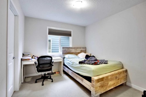 16 Silverado Skies Lane Sw, Calgary, AB - Indoor Photo Showing Bedroom