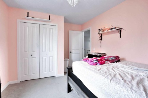 16 Silverado Skies Lane Sw, Calgary, AB - Indoor Photo Showing Bedroom