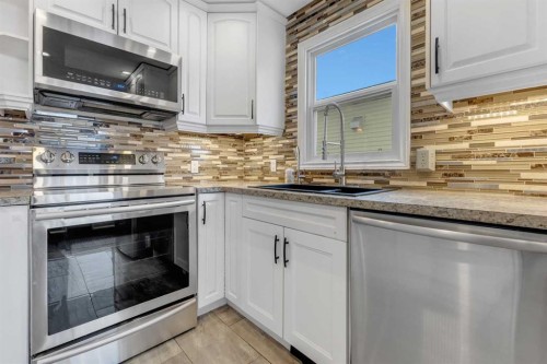 4 Mckernan Place Se, Calgary, AB - Indoor Photo Showing Kitchen With Double Sink With Upgraded Kitchen