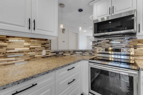 4 Mckernan Place Se, Calgary, AB - Indoor Photo Showing Kitchen With Upgraded Kitchen