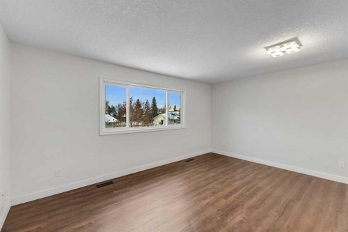 4 Mckernan Place Se, Calgary, AB - Indoor Photo Showing Other Room