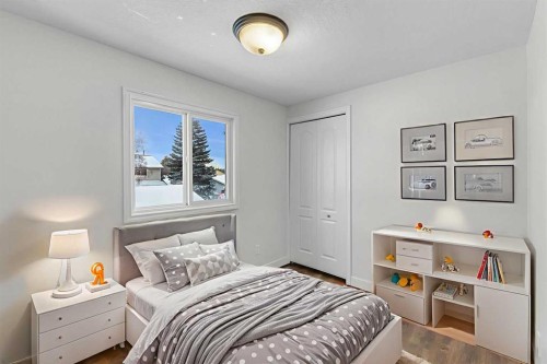 4 Mckernan Place Se, Calgary, AB - Indoor Photo Showing Bedroom