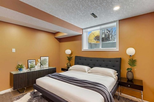 4 Mckernan Place Se, Calgary, AB - Indoor Photo Showing Bedroom
