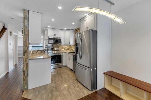 4 Mckernan Place Se, Calgary, AB - Indoor Photo Showing Kitchen With Upgraded Kitchen