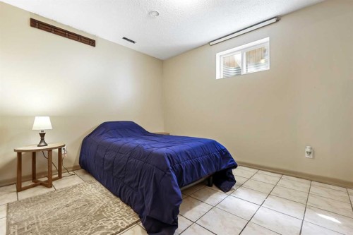 63 Olympia Crescent Se, Calgary, AB - Indoor Photo Showing Bedroom