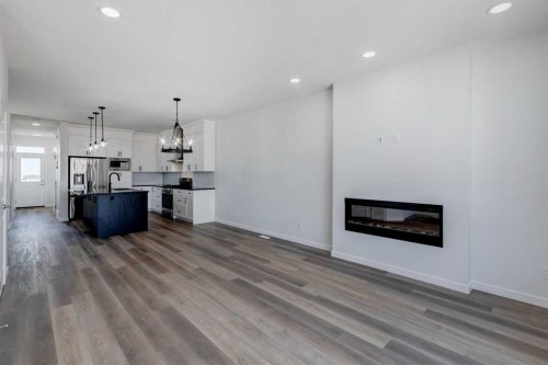 149 Homestead View Ne, Calgary, AB - Indoor Photo Showing Other Room With Fireplace