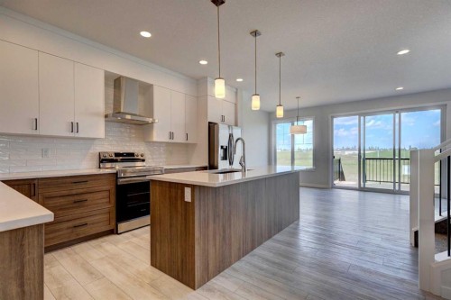 98 Silver Spruce Road Sw, Calgary, AB - Indoor Photo Showing Kitchen With Upgraded Kitchen