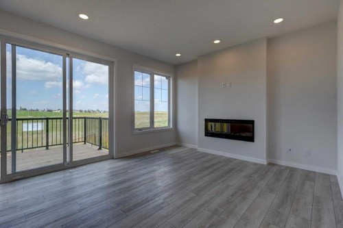 98 Silver Spruce Road Sw, Calgary, AB - Indoor Photo Showing Other Room With Fireplace