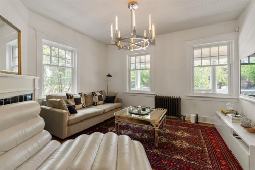 3025 Elbow Drive Sw, Calgary, AB - Indoor Photo Showing Living Room With Fireplace