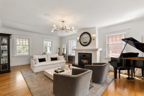 3025 Elbow Drive Sw, Calgary, AB - Indoor Photo Showing Living Room With Fireplace
