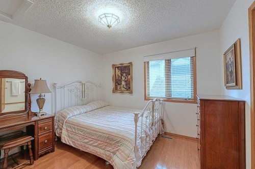 115 Strathaven Circle Sw, Calgary, AB - Indoor Photo Showing Bedroom