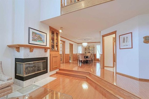 115 Strathaven Circle Sw, Calgary, AB - Indoor With Fireplace