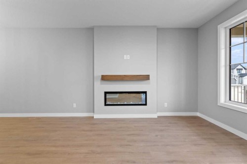 191 Belvedere Crescent Se, Calgary, AB - Indoor Photo Showing Living Room With Fireplace