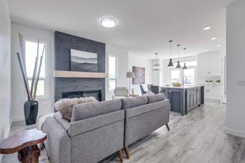 4240 Bauman Way, Innisfail, AB - Indoor Photo Showing Living Room With Fireplace