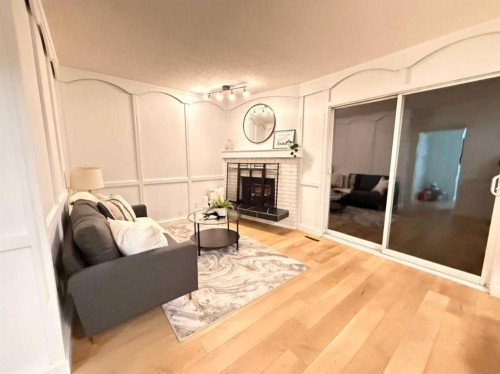5632 Dalhousie Drive Nw, Calgary, AB - Indoor Photo Showing Living Room With Fireplace