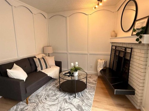5632 Dalhousie Drive Nw, Calgary, AB - Indoor Photo Showing Living Room With Fireplace