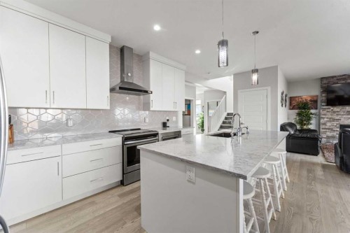 804 Shawnee Terrace Sw, Calgary, AB - Indoor Photo Showing Kitchen With Fireplace With Upgraded Kitchen