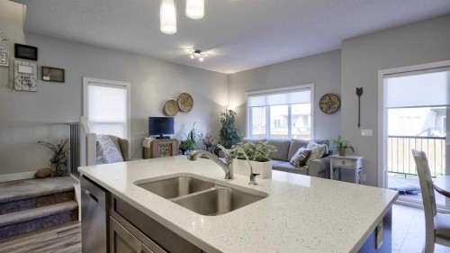 135 Reunion Loop Nw, Airdrie, AB - Indoor Photo Showing Kitchen With Double Sink