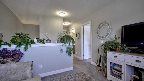 135 Reunion Loop Nw, Airdrie, AB - Indoor Photo Showing Other Room