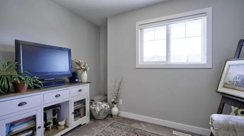 135 Reunion Loop Nw, Airdrie, AB - Indoor With Fireplace
