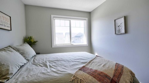 135 Reunion Loop Nw, Airdrie, AB - Indoor Photo Showing Bedroom