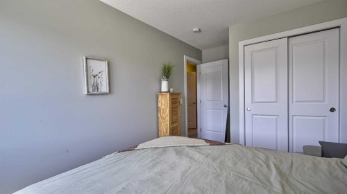 135 Reunion Loop Nw, Airdrie, AB - Indoor Photo Showing Bedroom