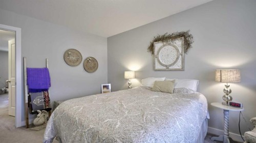 135 Reunion Loop Nw, Airdrie, AB - Indoor Photo Showing Bedroom