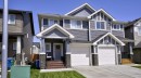 135 Reunion Loop Nw, Airdrie, AB  - Outdoor With Facade 