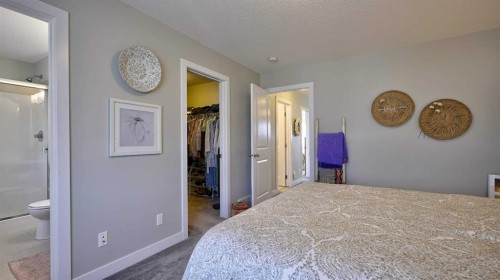 135 Reunion Loop Nw, Airdrie, AB - Indoor Photo Showing Bedroom