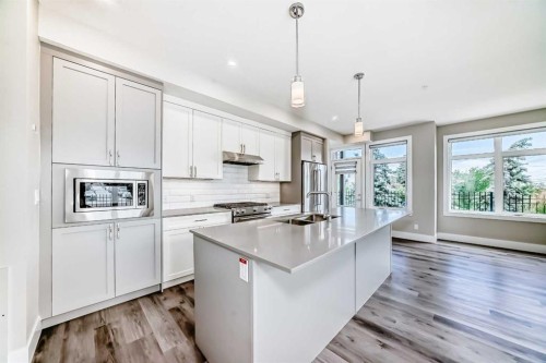 115-1702 17 Avenue Sw, Calgary, AB - Indoor Photo Showing Kitchen With Double Sink With Upgraded Kitchen