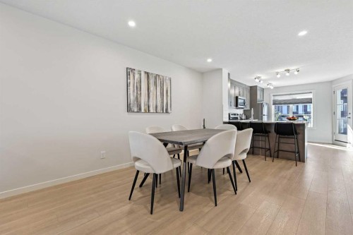 107-474 Seton Circle Se, Calgary, AB - Indoor Photo Showing Dining Room