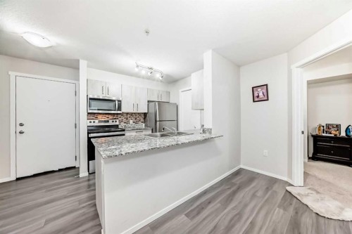 4513-4641 128 Avenue Ne, Calgary, AB - Indoor Photo Showing Kitchen With Double Sink