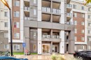 4513-4641 128 Avenue Ne, Calgary, AB  - Outdoor With Balcony With Facade 