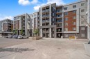 4513-4641 128 Avenue Ne, Calgary, AB  - Outdoor With Balcony With Facade 