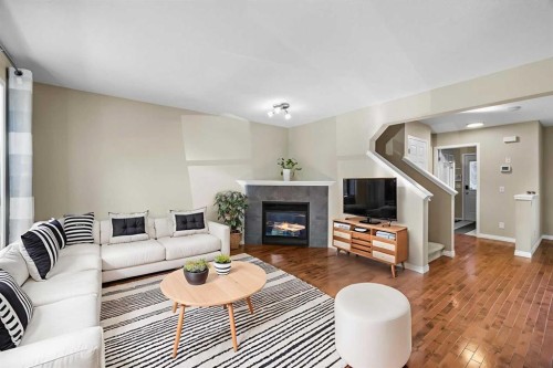 89 Mckenzie Towne Drive Se, Calgary, AB - Indoor Photo Showing Living Room With Fireplace