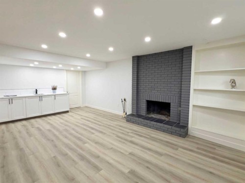 7032 78 Street Nw, Calgary, AB - Indoor With Fireplace