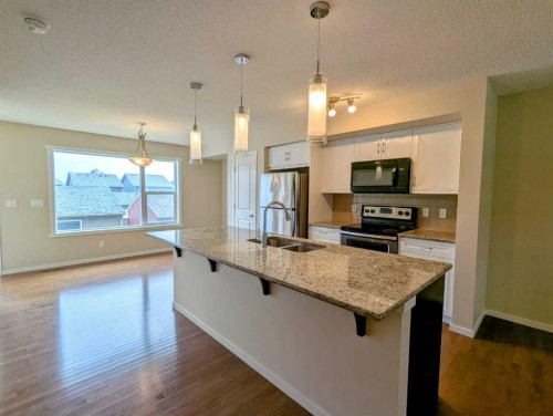 187 Evansborough Way Nw, Calgary, AB - Indoor Photo Showing Kitchen With Stainless Steel Kitchen With Double Sink With Upgraded Kitchen