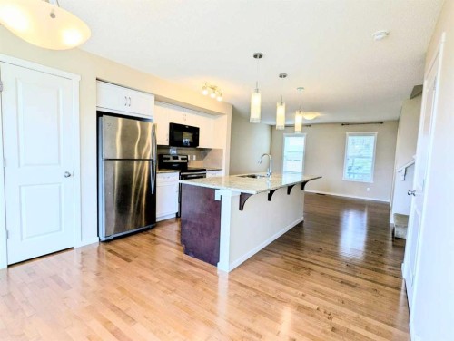 187 Evansborough Way Nw, Calgary, AB - Indoor Photo Showing Kitchen With Stainless Steel Kitchen With Double Sink With Upgraded Kitchen