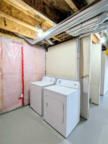 187 Evansborough Way Nw, Calgary, AB - Indoor Photo Showing Laundry Room