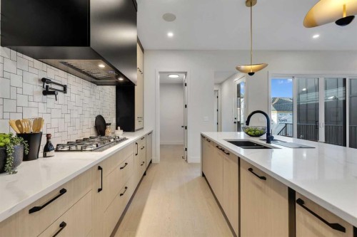 336 Normandy Drive Sw, Calgary, AB - Indoor Photo Showing Kitchen With Double Sink With Upgraded Kitchen
