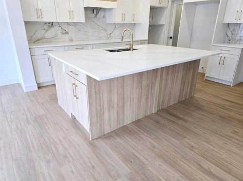 1350 Scarlett Ranch Boulevard, Carstairs, AB - Indoor Photo Showing Kitchen With Double Sink With Upgraded Kitchen