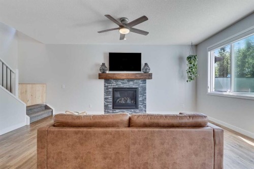 99 Legacy Glen Terrace Se, Calgary, AB - Indoor Photo Showing Living Room With Fireplace