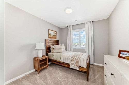 1014 Sawgrass Link Nw, Airdrie, AB - Indoor Photo Showing Bedroom