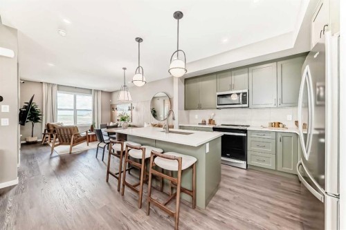 1014 Sawgrass Link Nw, Airdrie, AB - Indoor Photo Showing Kitchen With Stainless Steel Kitchen With Upgraded Kitchen