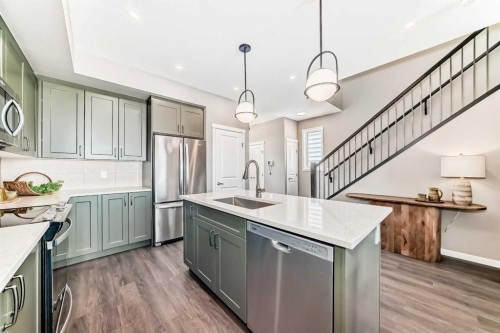 1014 Sawgrass Link Nw, Airdrie, AB - Indoor Photo Showing Kitchen With Stainless Steel Kitchen With Upgraded Kitchen