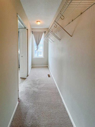 28 Kinlea Common Nw, Calgary, AB - Indoor Photo Showing Other Room