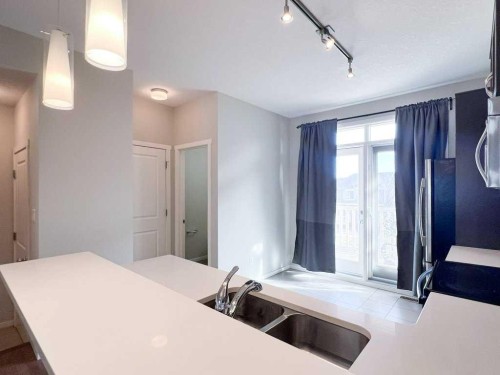 28 Kinlea Common Nw, Calgary, AB - Indoor Photo Showing Kitchen With Double Sink