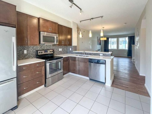28 Kinlea Common Nw, Calgary, AB - Indoor Photo Showing Kitchen With Double Sink With Upgraded Kitchen