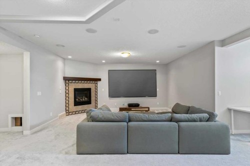 13 Sage Hill Landing Nw, Calgary, AB - Indoor Photo Showing Living Room With Fireplace