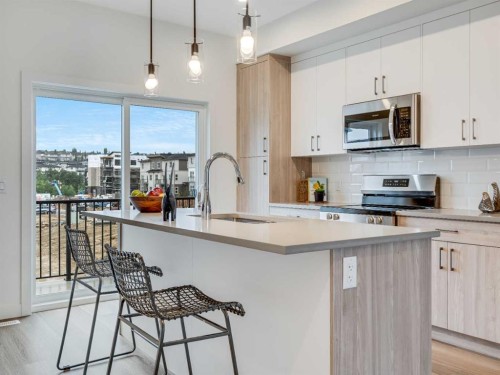 105-2231 81 Street Sw, Calgary, AB - Indoor Photo Showing Kitchen With Upgraded Kitchen
